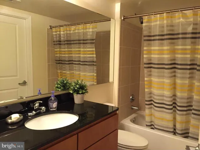 a bathroom with a sink and a shower