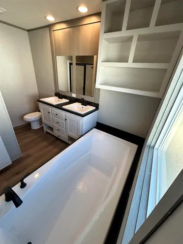 a bathroom with a sink vanity and a mirror