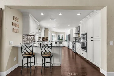 a living room with pool table and a couch