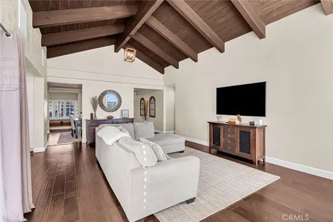 a view of work space with furniture and wooden floor