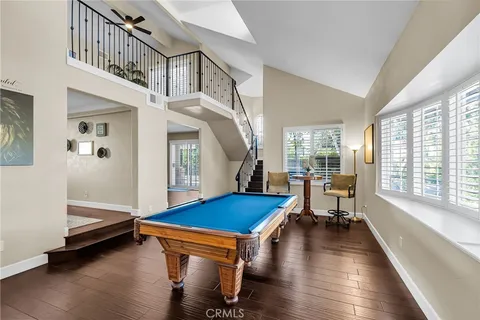 a living room with fireplace furniture and a floor to ceiling window