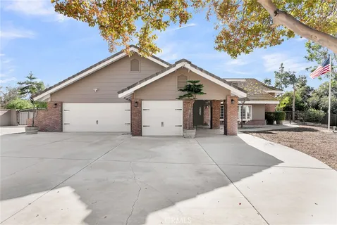 a front view of a house with trees