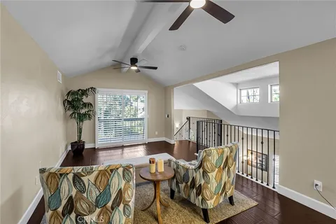 a view of a backyard with seating area