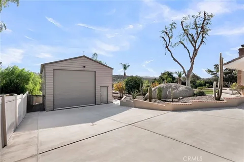 a view of a house with a tree