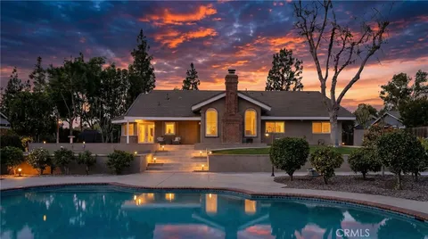 a kitchen with stainless steel appliances granite countertop white cabinets and sink