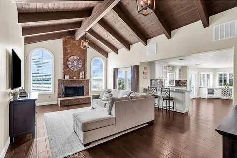 a kitchen with stainless steel appliances white cabinets and a refrigerator