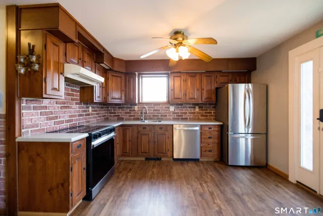 a view of a kitchen with furniture and a fireplace