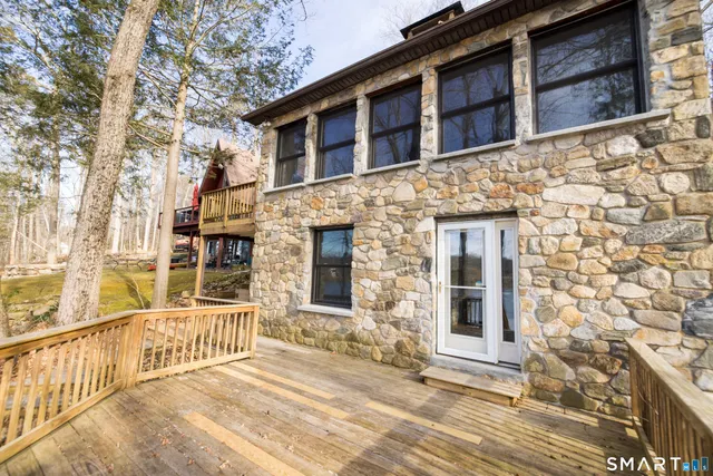 a view of wooden balcony with wooden floor and fence