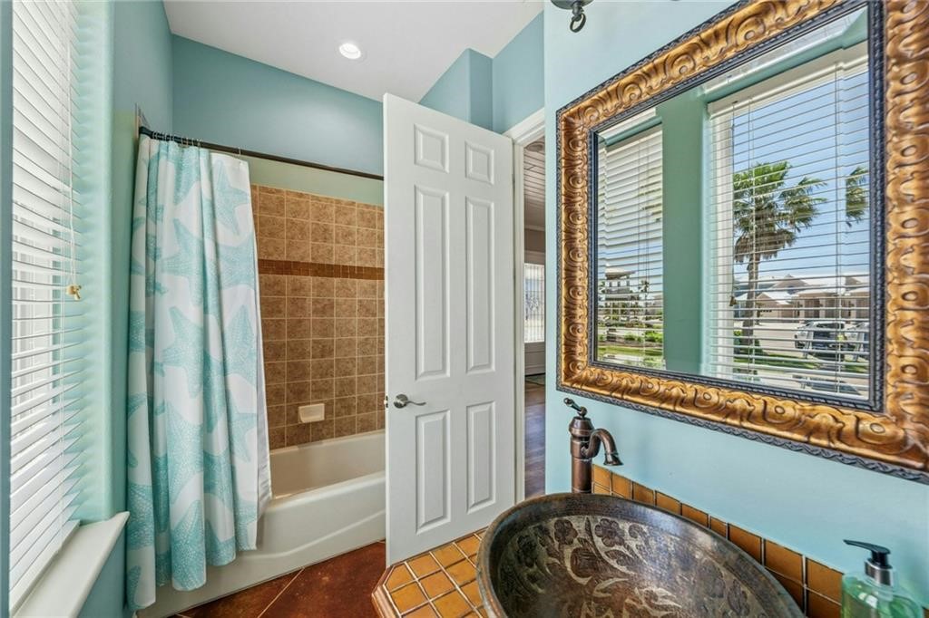 6 Sea Shell Shores Rockport, TX 78382 - Photo 13 of 37 a view of a door and chair in a room