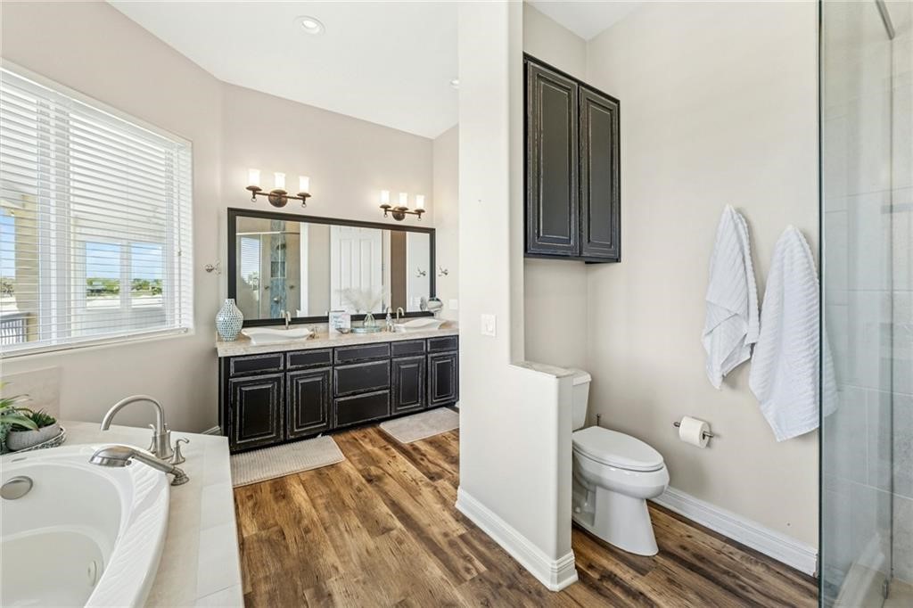 6 Sea Shell Shores Rockport, TX 78382 - Photo 18 of 37 a bathroom with a sink a toilet and mirror