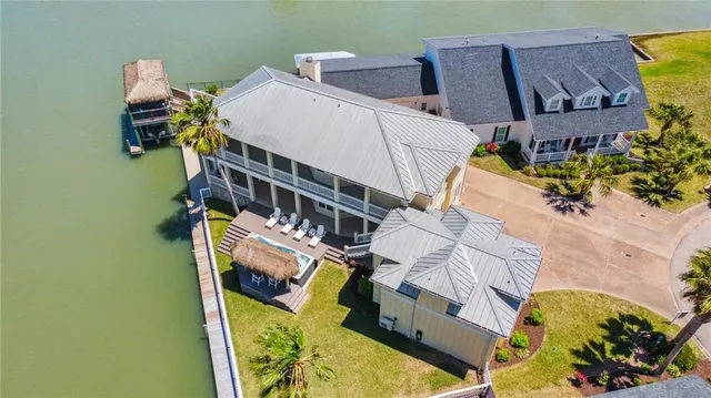 an aerial view of a house with swimming pool