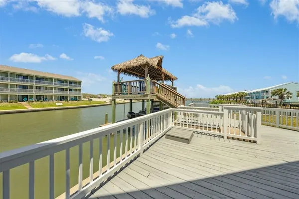a view of a balcony with wooden floor and city view