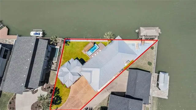 a view of a balcony with furniture and wooden floor