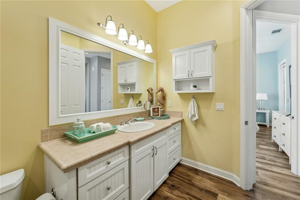 6 Sea Shell Shores Rockport, TX 78382 - Photo 33 of 37 a spacious bathroom with a granite countertop sink and a mirror