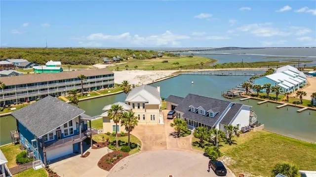 an aerial view of a residential building and lake view