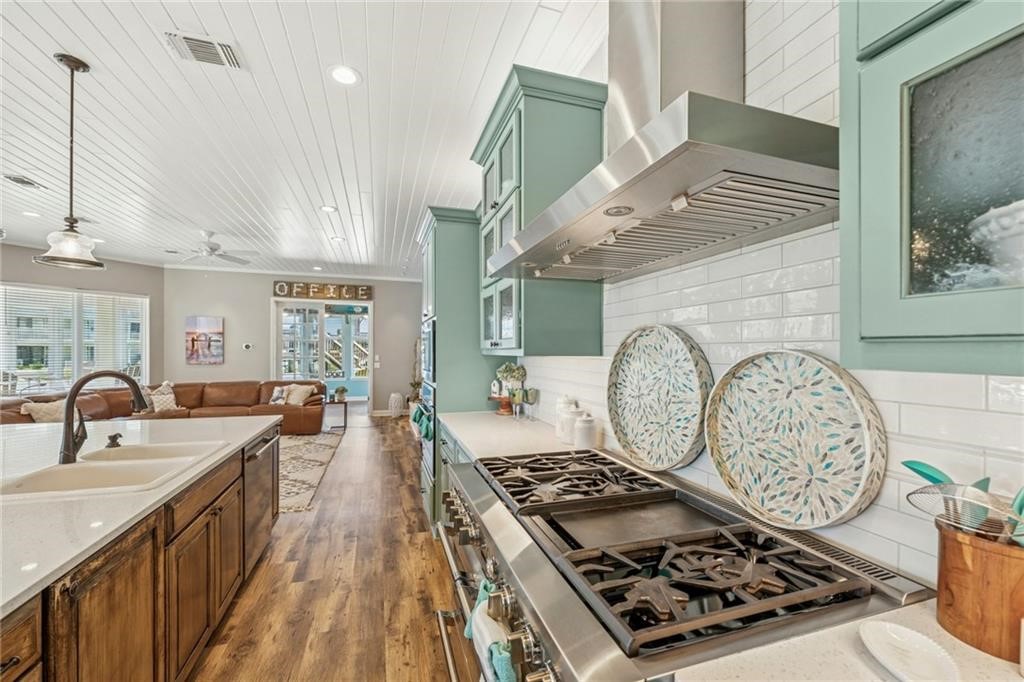 6 Sea Shell Shores Rockport, TX 78382 - Photo 6 of 37 a kitchen with stove a sink and a dining table