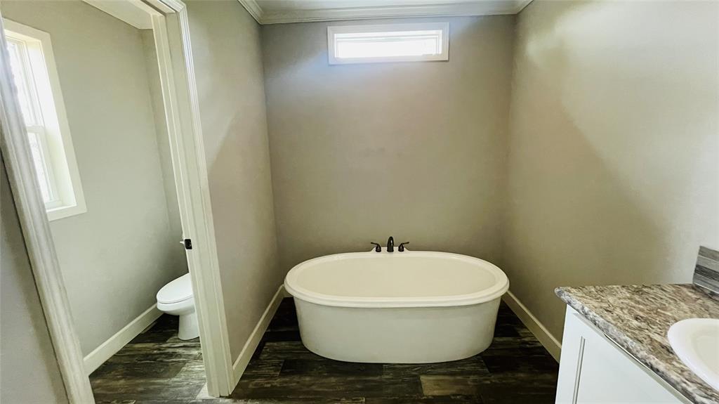 8394 Lake Road Mansfield, TX 76063 - Photo 22 of 22 a bathroom with a toilet and a sink