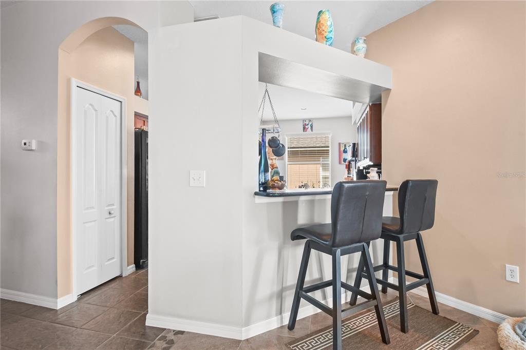 11130 Rodeo Lane Riverview, FL 33579 - Photo 15 of 49 a view of a dining room with furniture and wooden floor
