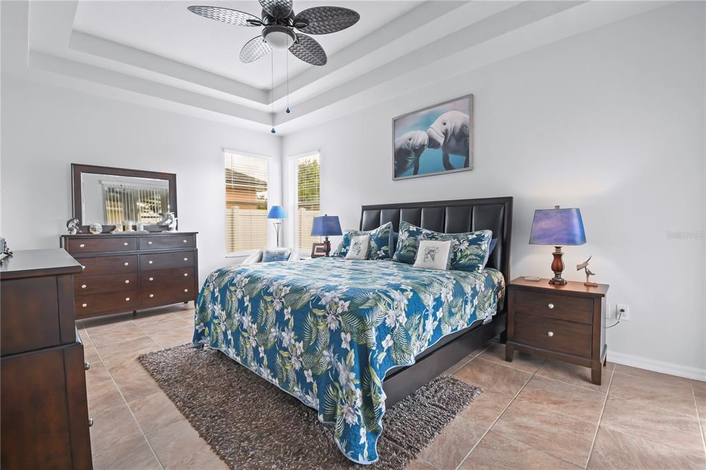 11130 Rodeo Lane Riverview, FL 33579 - Photo 16 of 49 a bed sitting in a bedroom and night stand