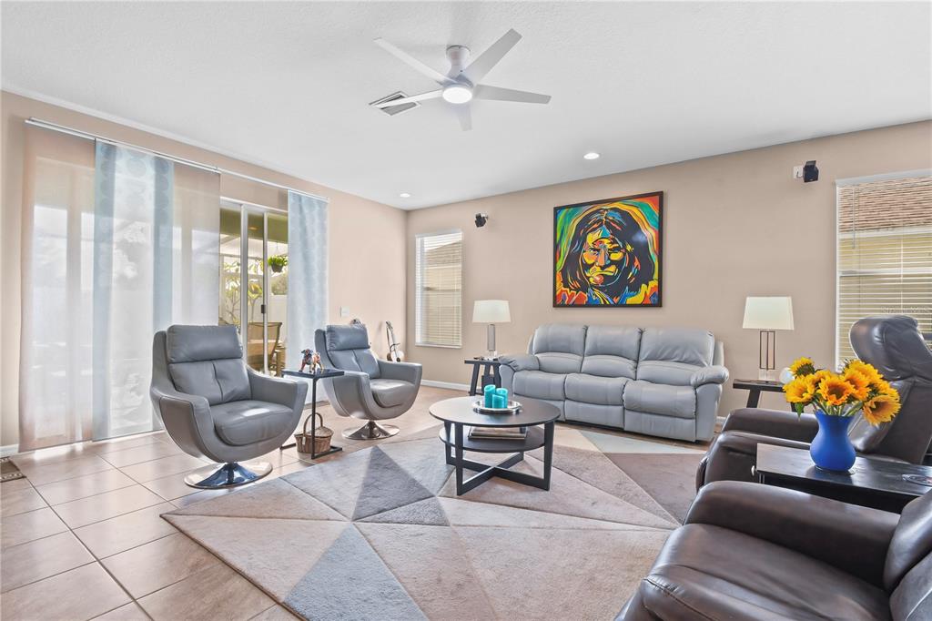 11130 Rodeo Lane Riverview, FL 33579 - Photo 2 of 49 a living room with furniture and a large window