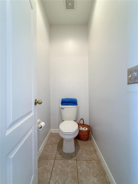11130 Rodeo Lane Riverview, FL 33579 - Photo 25 of 49 a white toilet sitting in a bathroom