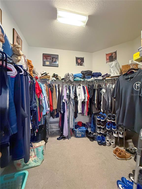 11130 Rodeo Lane Riverview, FL 33579 - Photo 27 of 49 a view of walk in closet with clothes