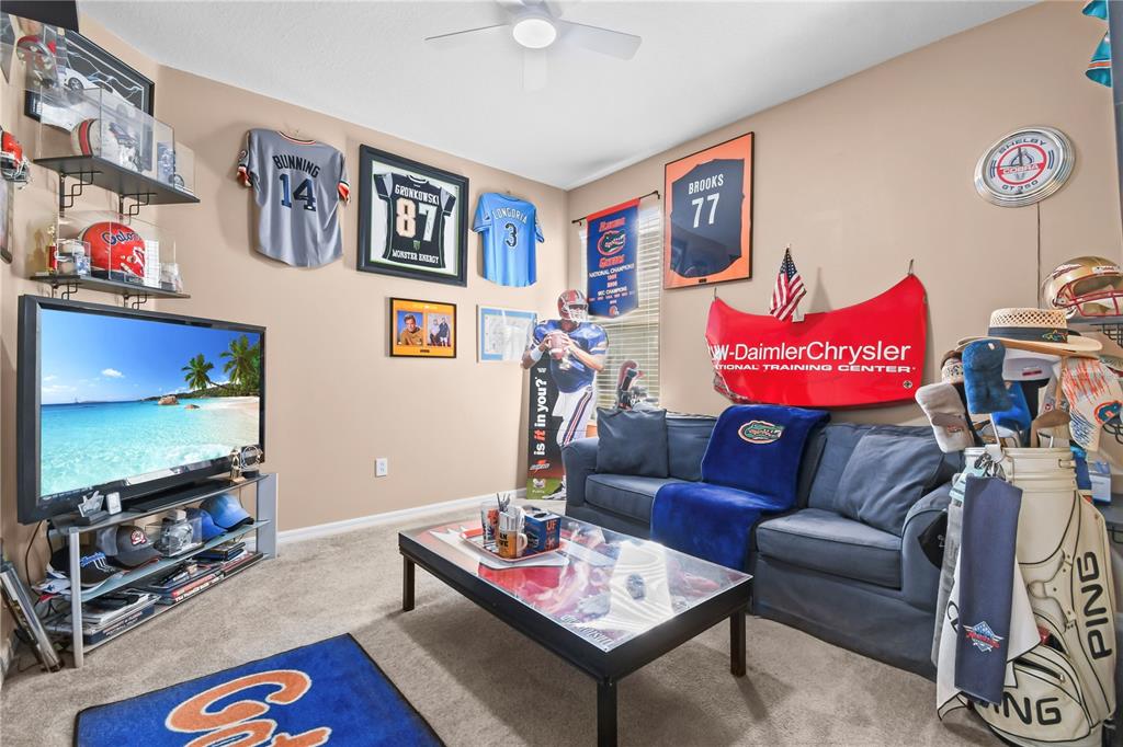 11130 Rodeo Lane Riverview, FL 33579 - Photo 28 of 49 a living room with furniture and a flat screen tv