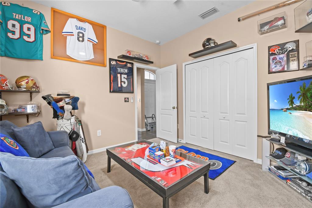 11130 Rodeo Lane Riverview, FL 33579 - Photo 29 of 49 a living room with furniture and a flat screen tv