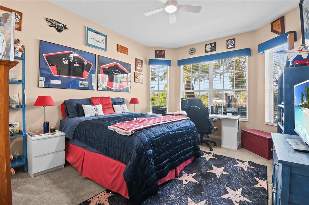 11130 Rodeo Lane Riverview, FL 33579 - Photo 31 of 49 a bedroom with a bed dresser and window