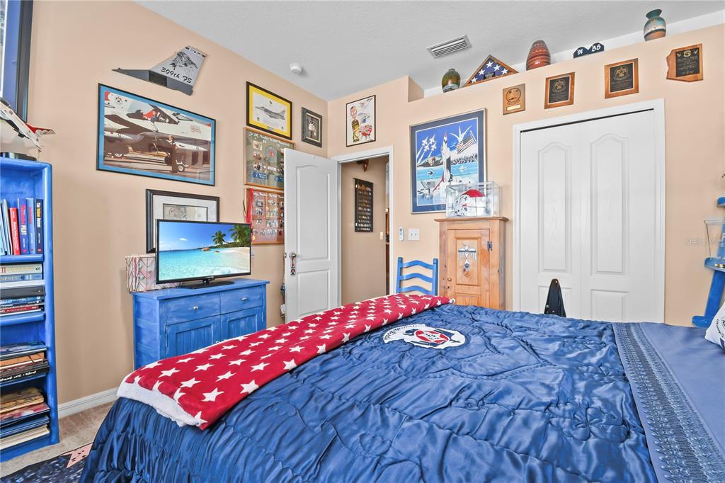 11130 Rodeo Lane Riverview, FL 33579 - Photo 34 of 49 a bedroom with a bed and dresser with it