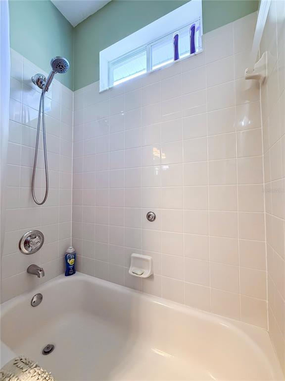 11130 Rodeo Lane Riverview, FL 33579 - Photo 37 of 49 a bathroom with a tub and a shower