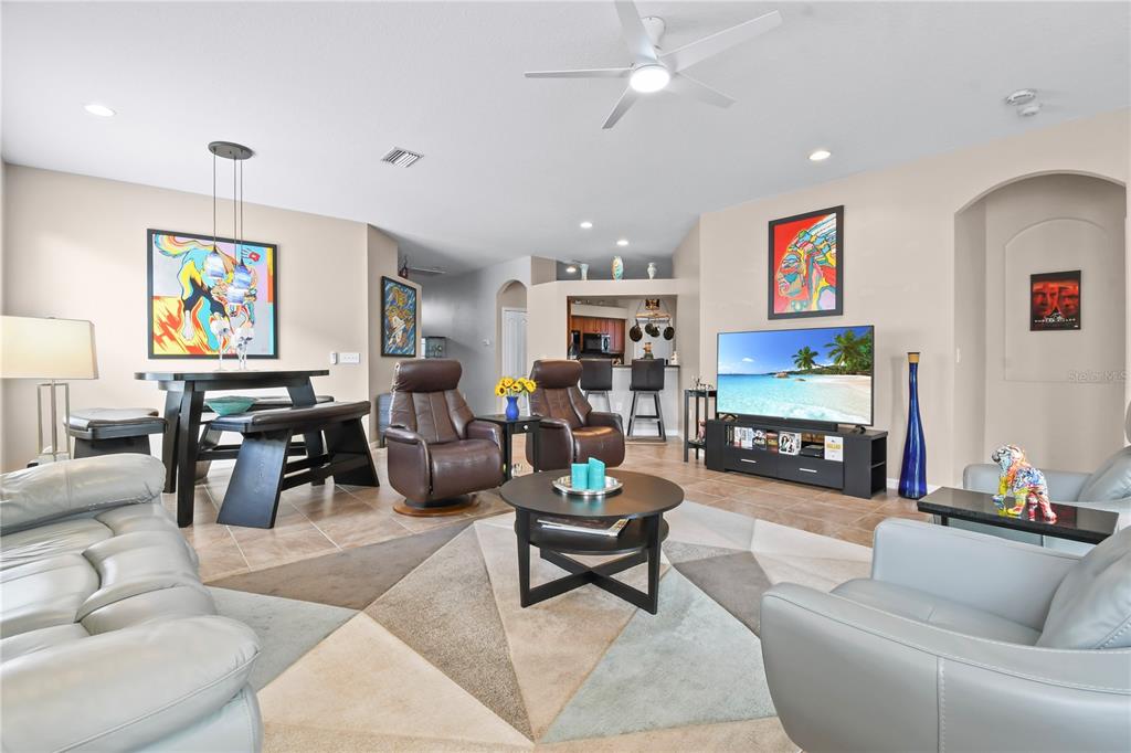 11130 Rodeo Lane Riverview, FL 33579 - Photo 5 of 49 a living room with fireplace furniture and a flat screen tv