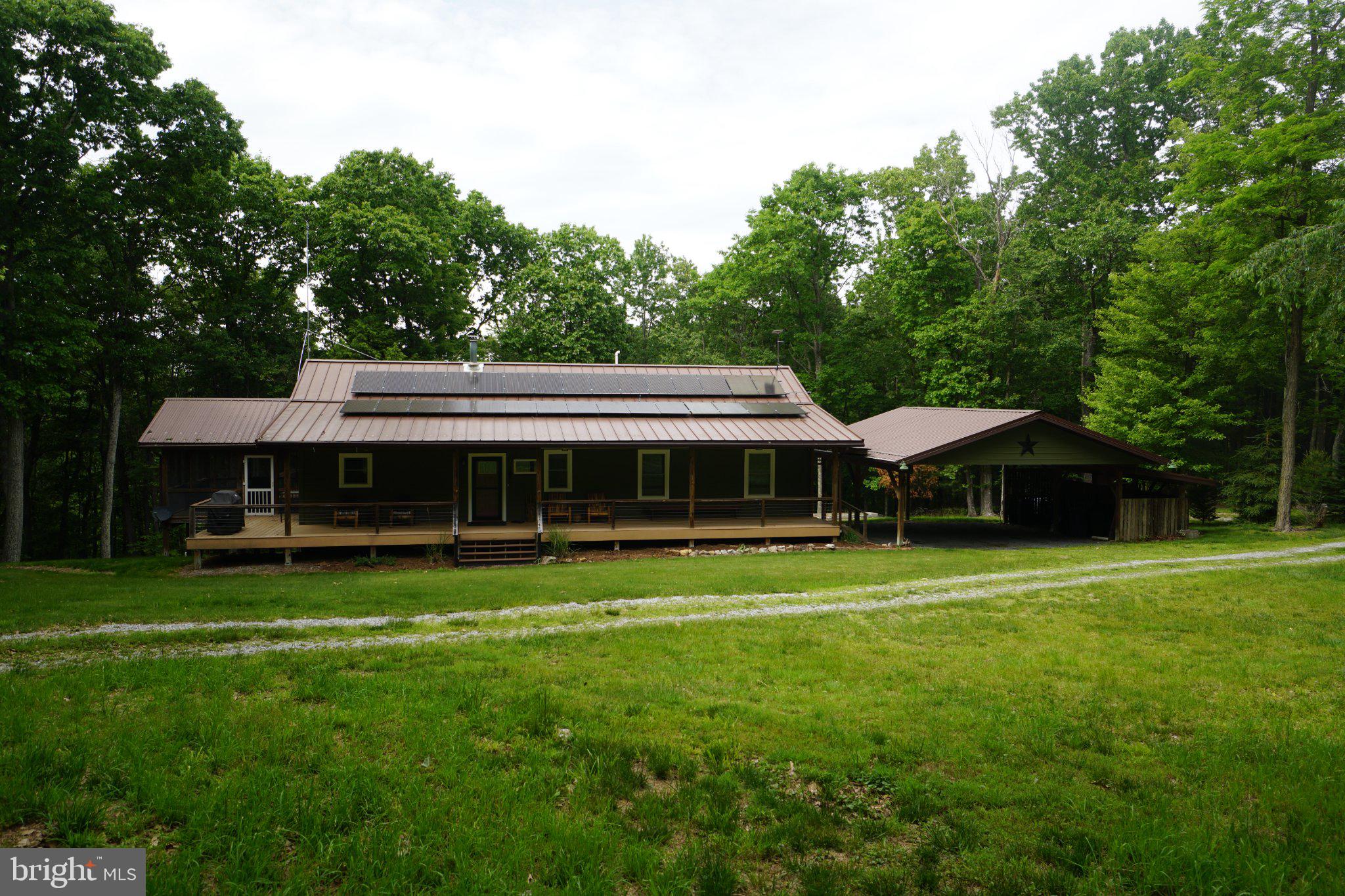 150 Sharp Ridge Lane Franklin, WV 26807 - Photo 1 of 69 Charming home nestled in lush greenery.
