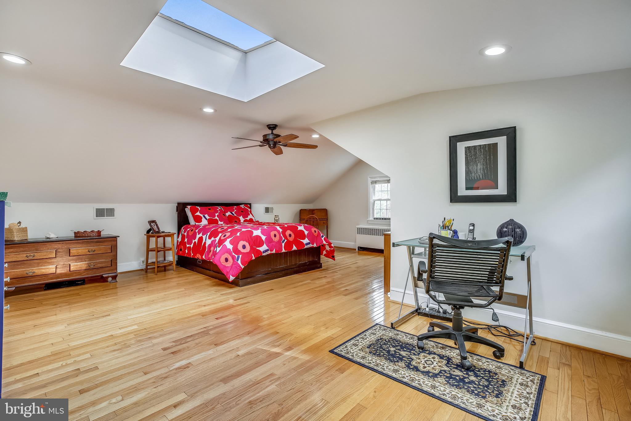 10328 Parkman Road Silver Spring, MD 20903 - Photo 22 of 46 a bedroom with furniture and a wooden floor