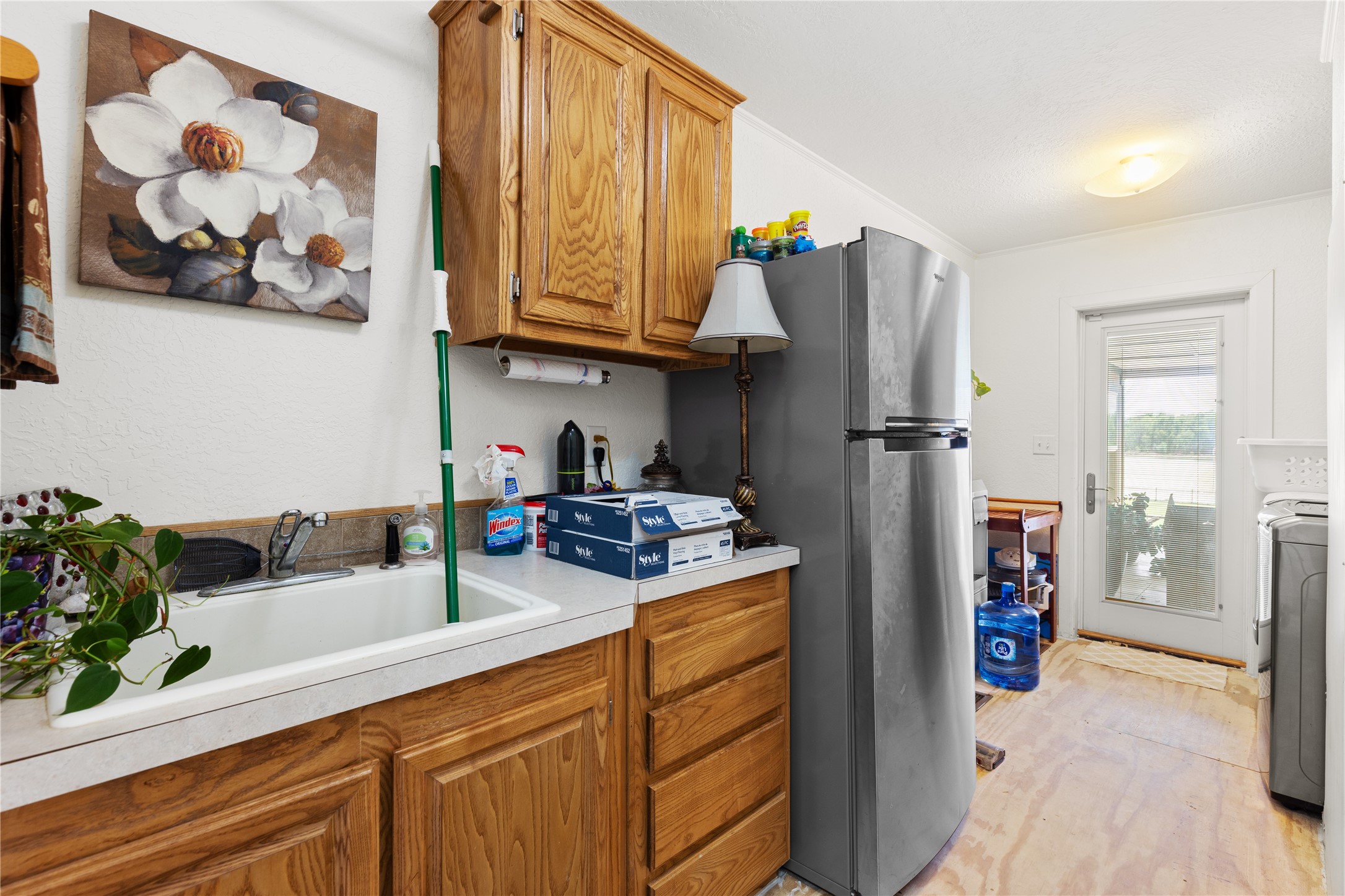 174 Lake Front Drive Trinity, TX 75862 - Photo 29 of 44 a kitchen with stainless steel appliances granite countertop a refrigerator and a sink