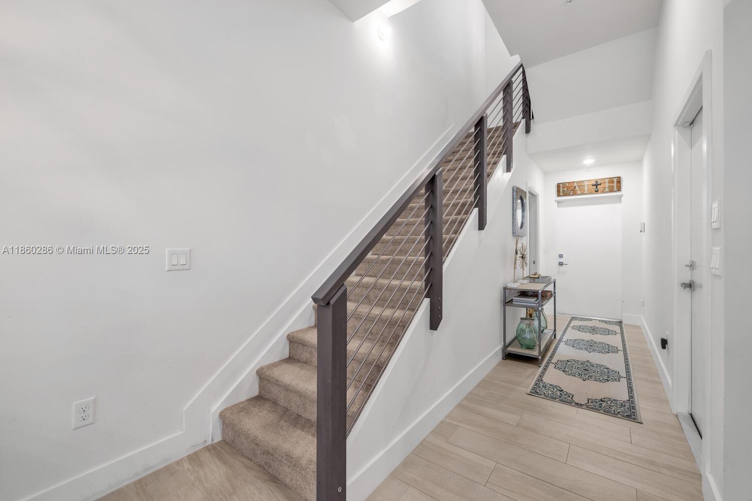 4444 Northwest 8th Court Plantation, FL 33317 - Photo 15 of 40 a view of entryway and hall with wooden floor