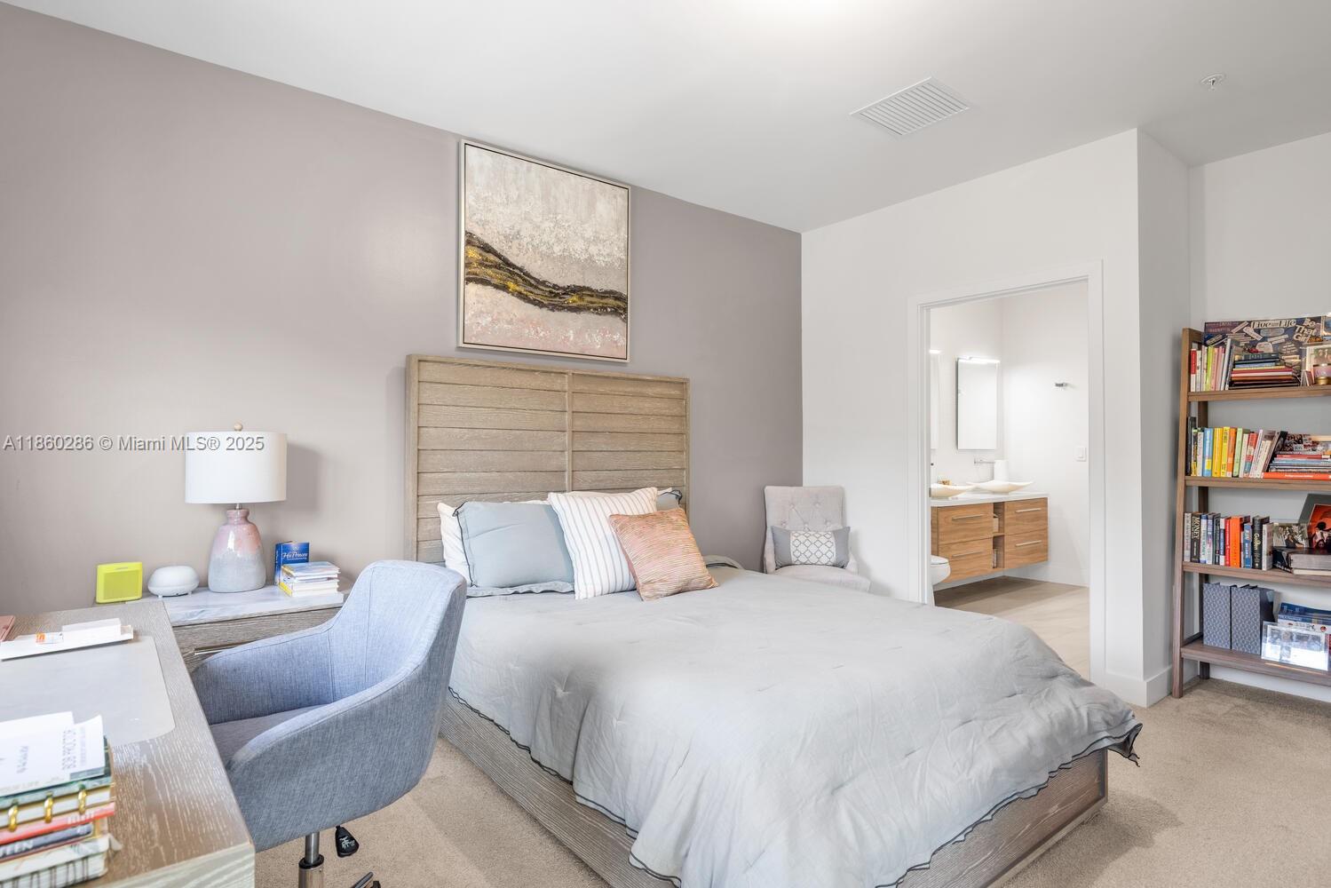 4444 Northwest 8th Court Plantation, FL 33317 - Photo 17 of 40 a bedroom with a bed furniture and a book shelf