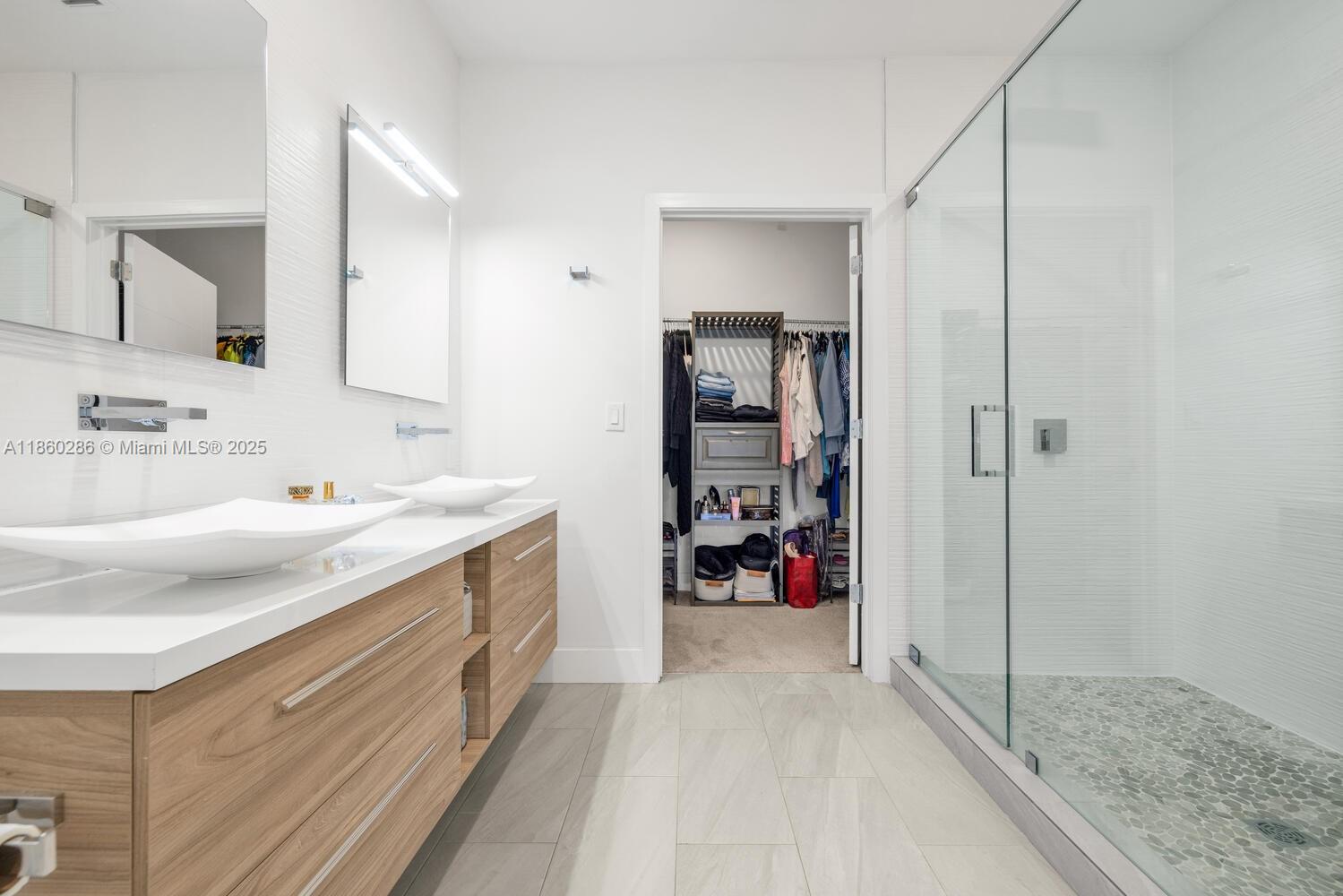 4444 Northwest 8th Court Plantation, FL 33317 - Photo 19 of 40 a spacious bathroom with a granite countertop sink and a mirror