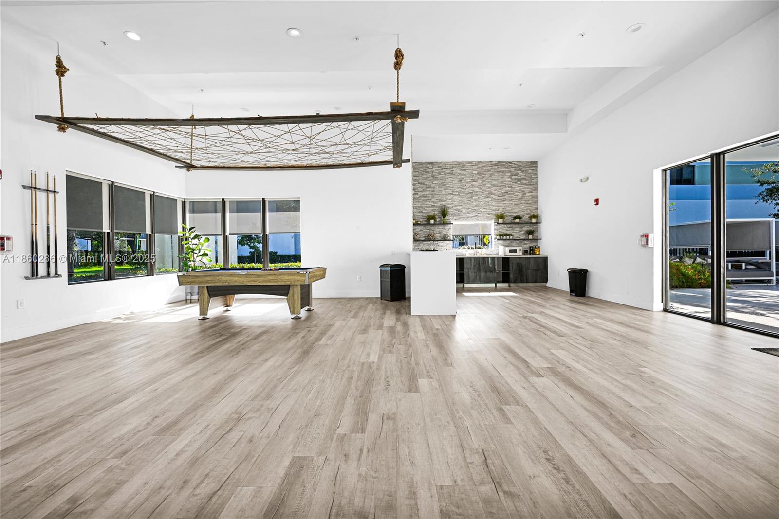 4444 Northwest 8th Court Plantation, FL 33317 - Photo 35 of 40 a living room with furniture and large windows
