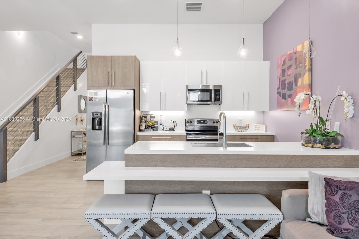 4444 Northwest 8th Court Plantation, FL 33317 - Photo 4 of 40 a living room with furniture and kitchen view