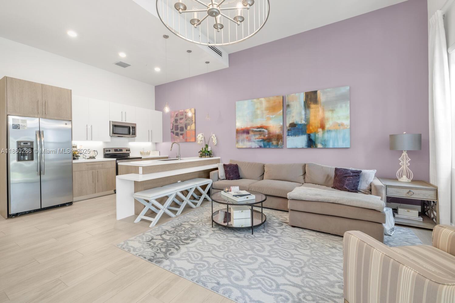 4444 Northwest 8th Court Plantation, FL 33317 - Photo 6 of 40 a living room with stainless steel appliances kitchen island granite countertop furniture and a large window