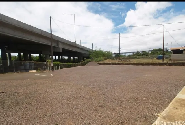 a view of a street with a building in the background