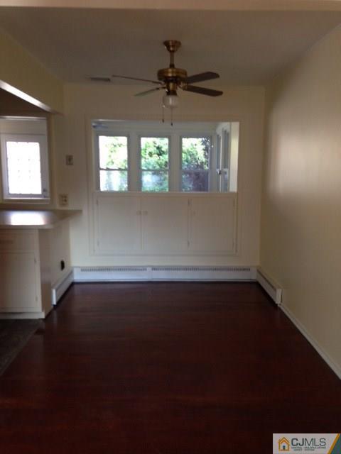 171 Midfield Road Colonia, NJ 07067 - Photo 5 of 12 wooden floor in an empty room with a window