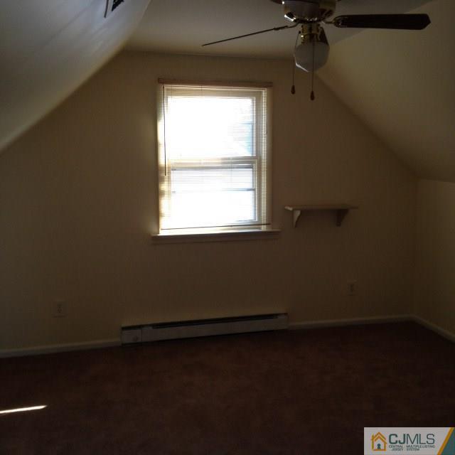 171 Midfield Road Colonia, NJ 07067 - Photo 9 of 12 an empty room with a window