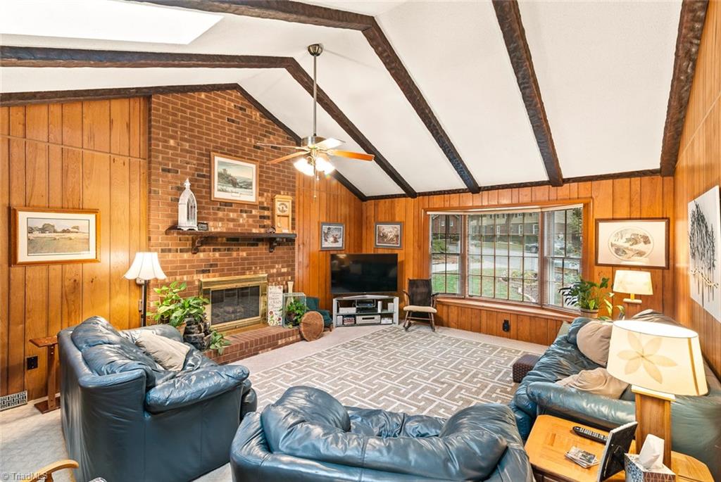 1701 Scarborough Road High Point, NC 27265 - Photo 12 of 30 SPACIOUS Den off kitchen boasts vaulted beamed ceilings and skylights
