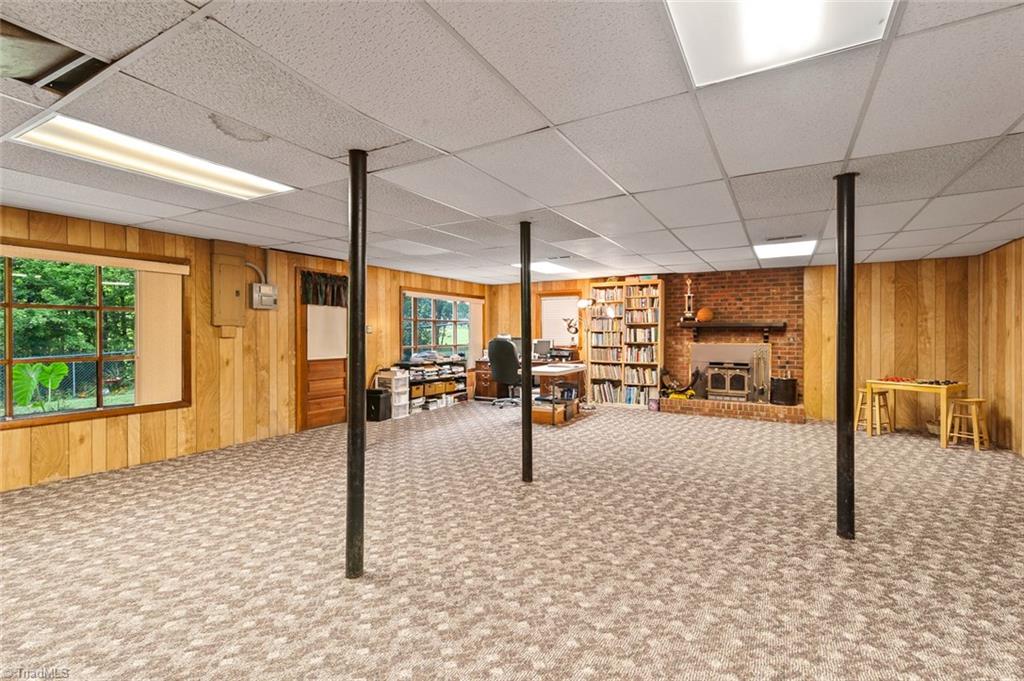 1701 Scarborough Road High Point, NC 27265 - Photo 22 of 30 WOW! FULL FINISHED basement with separate entry and wood burning fireplace! Endless possibilities! Full bath is also located in the basement