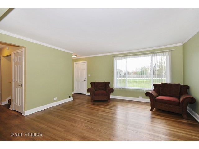 27-w003 Geneva Road Wheaton, IL 60187 - Photo 3 of 16 a living room with furniture and a large window