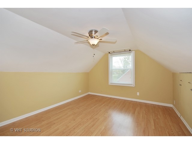 27-w003 Geneva Road Wheaton, IL 60187 - Photo 8 of 16 a view of an empty room with a window