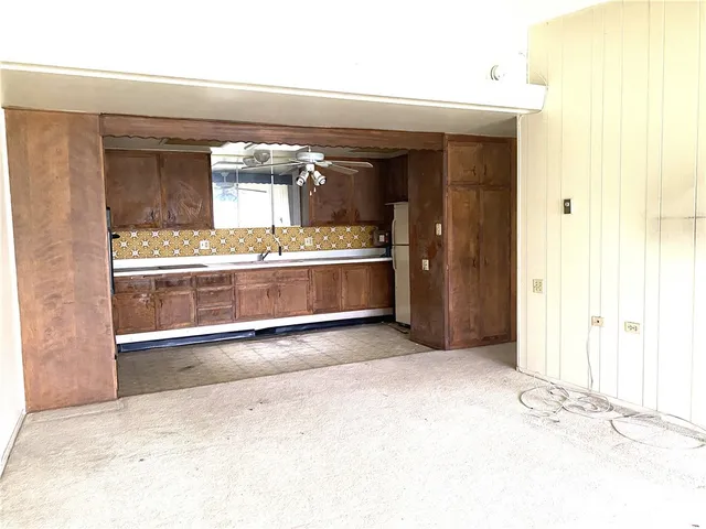 an empty room with a fireplace