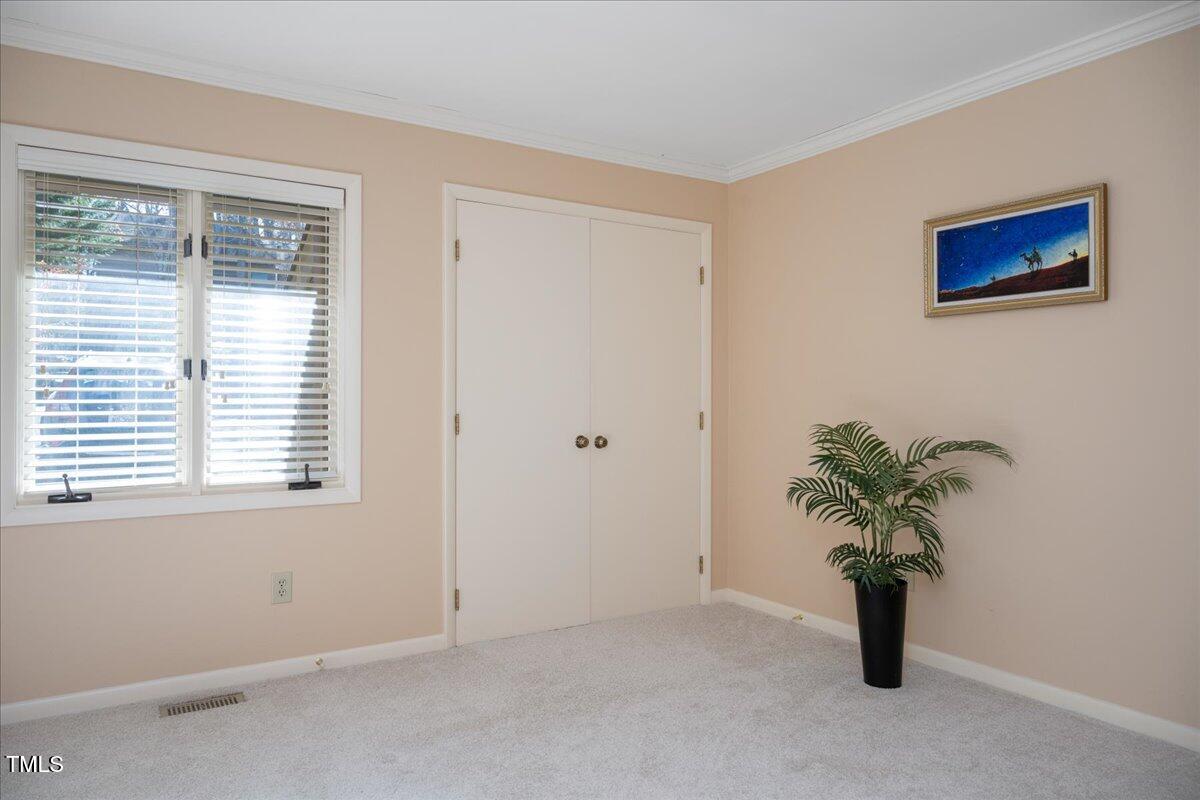 55 Stoneridge Road Durham, NC 27705 - Photo 23 of 35 a view of an empty room with a window